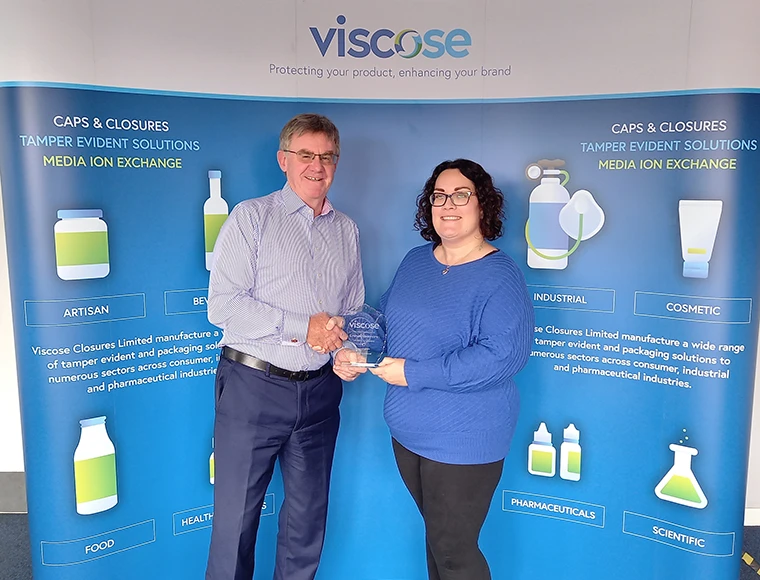 Emma Blackmore receiving an award in the end of year round up at Viscose HQ