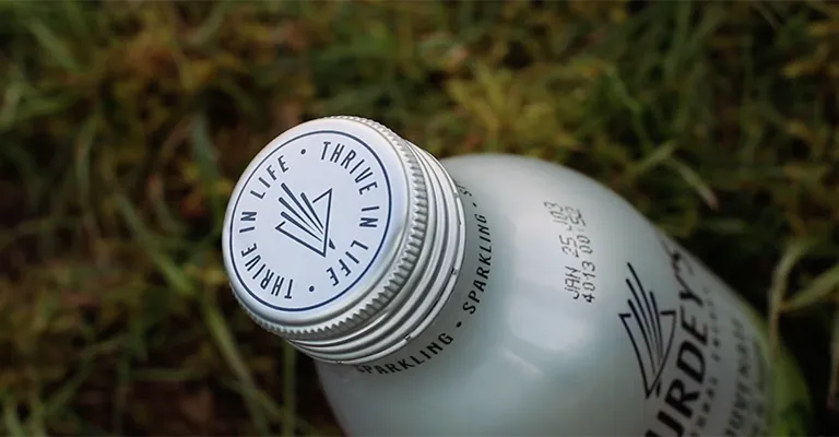 Decorative packaging on a metal drinks bottle