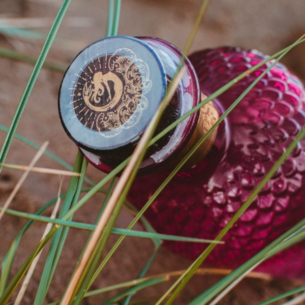 Close up of a gin bottle with a tamper evident sleeve
