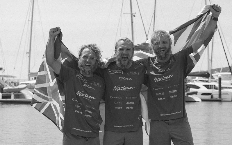 3 Rowers Holding A British Flag